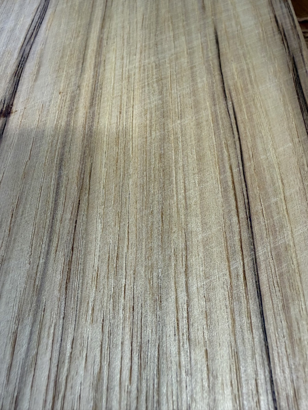 Rejected wood veneer sheet with knife scratches that will not sand out