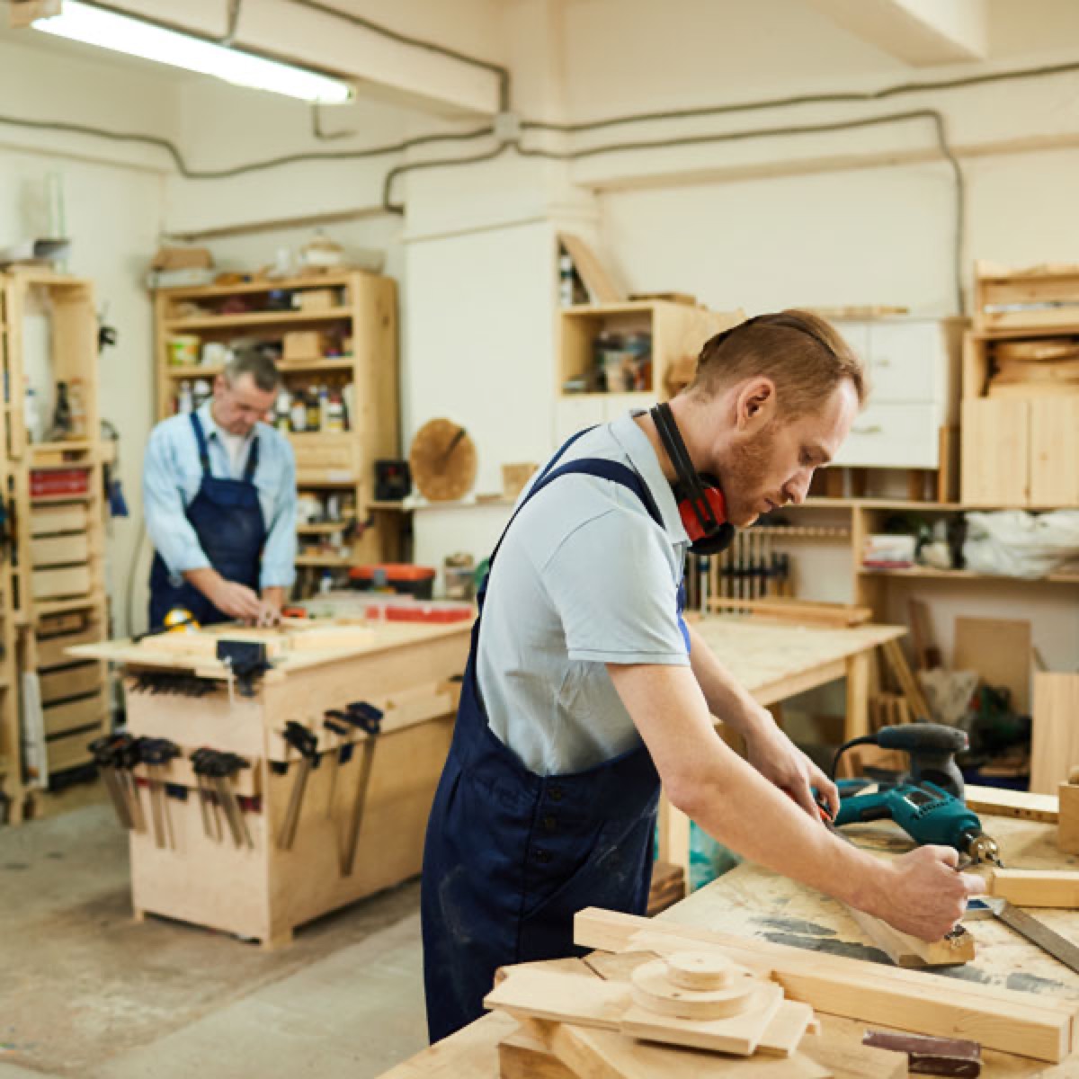 Craftspeople working wood in the shop