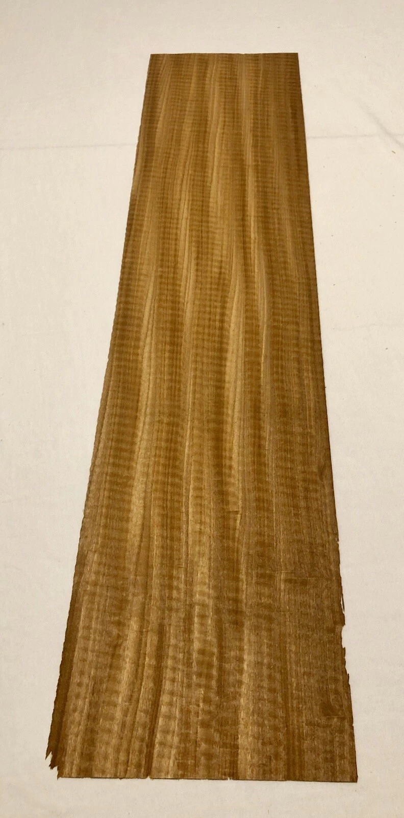 Anigre veneer sheet showing natural grain