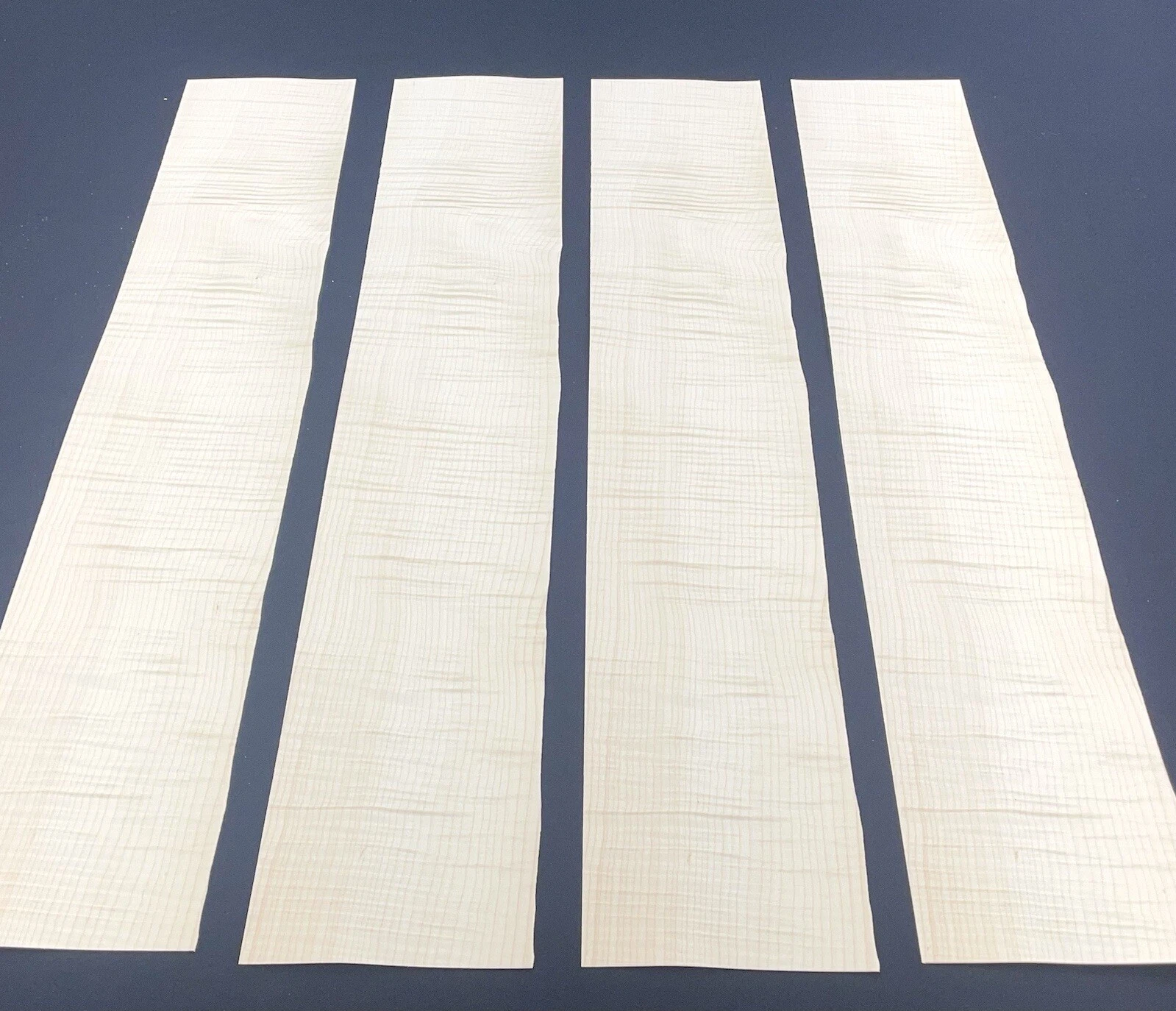 Figured maple veneer showing tiger stripe curl