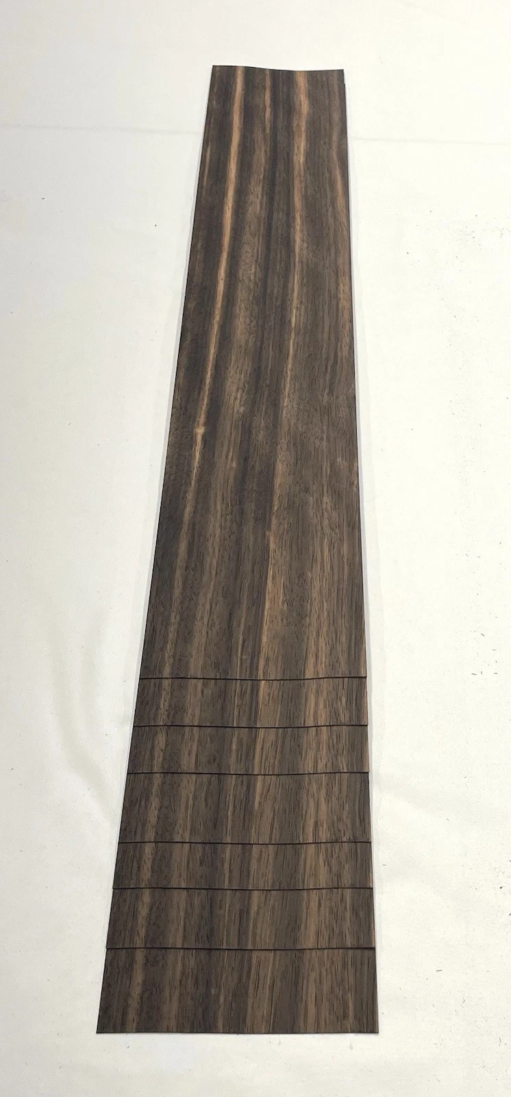 Macassar Ebony veneer sheet showing natural grain
